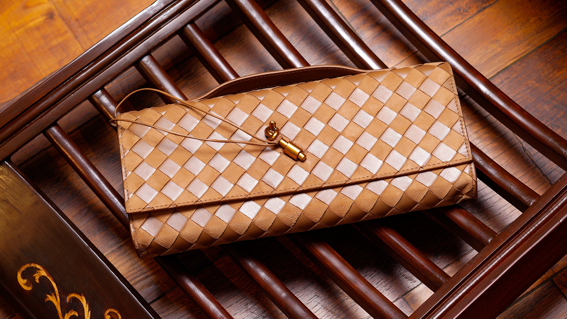 Discover the Andiamo White Intrecciato Leather Clutch with Knot Closure